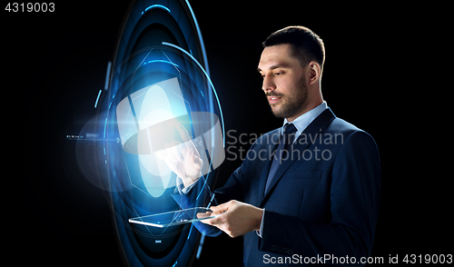 Image of businessman with tablet pc and virtual projection