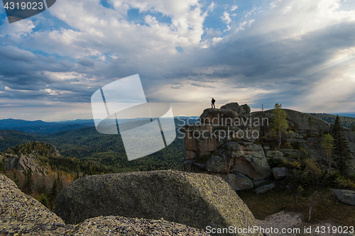 Image of Man on the peak in mountains