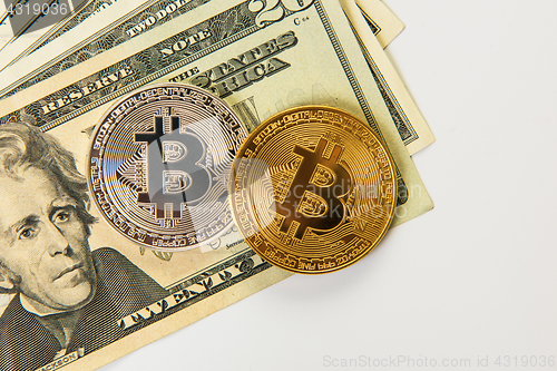 Image of Bitcoin coin with dollars