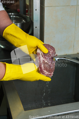 Image of washing and cleaning meat