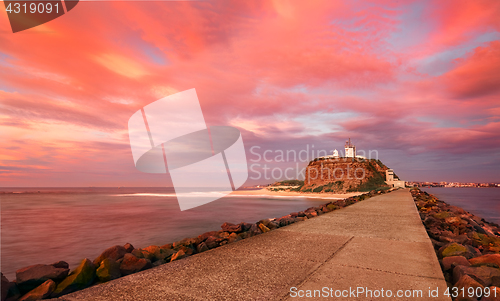 Image of Red sunrise at Nobby\'s Lighthouse Australia