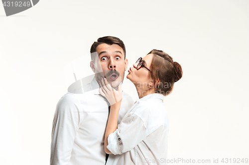 Image of The business man and woman communicating on a gray background