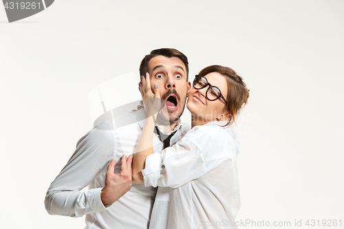 Image of The business man and woman communicating on a gray background