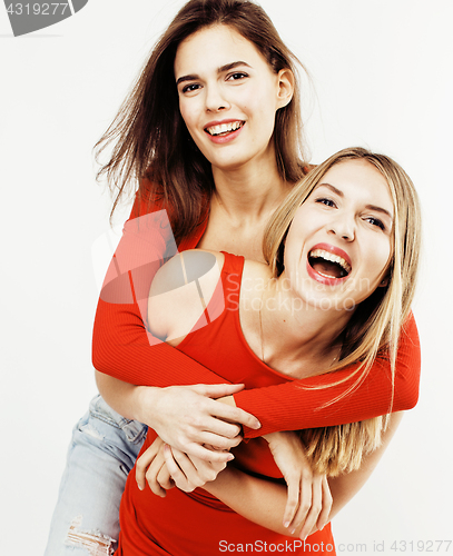 Image of best friends teenage girls together having fun, posing emotional on white background, besties happy smiling, lifestyle people concept close up