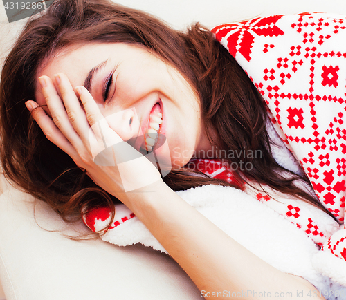 Image of young pretty brunette woman in her bedroom sitting at window, happy smiling lifestyle people concept 