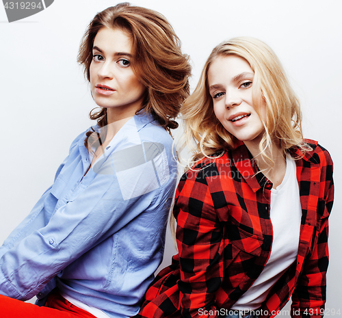 Image of best friends teenage girls together having fun, posing emotional on white background, besties happy smiling, lifestyle people concept close up