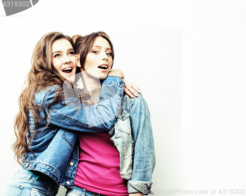 Image of best friends teenage girls together having fun, posing emotional on white background, besties happy smiling, lifestyle people concept close up