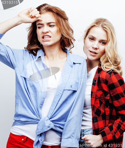 Image of best friends teenage girls together having fun, posing emotional on white background, besties happy smiling, lifestyle people concept close up