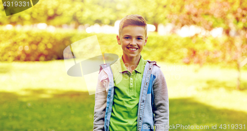 Image of happy smiling boy at summer park