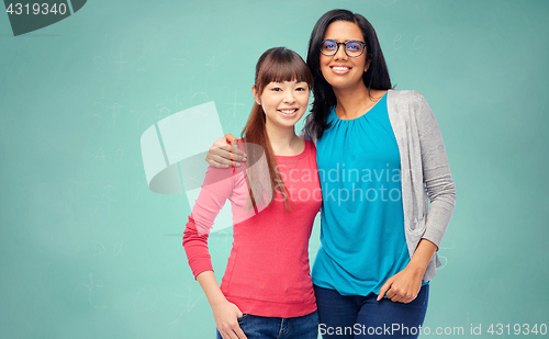 Image of international students over school chalk board