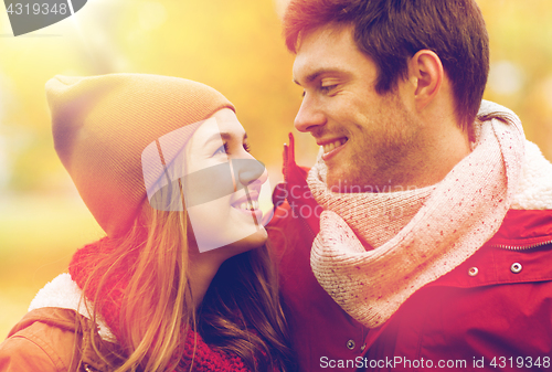 Image of close up of happy couple walking in autumn park
