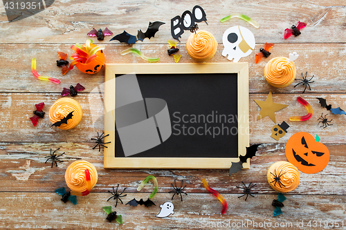 Image of blank chalkboard and halloween party decorations