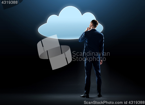 Image of businessman looking at virtual cloud hologram