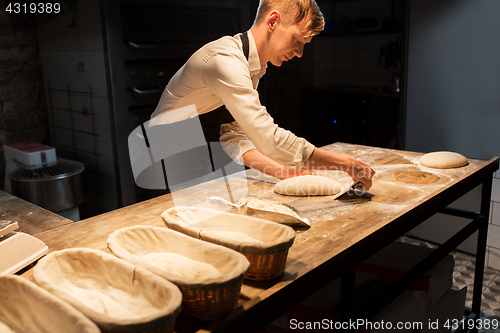 Image of chef or baker making dough at bakery