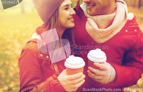 Image of close up of happy couple with coffee in autumn