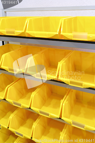 Image of Yellow plastic racks