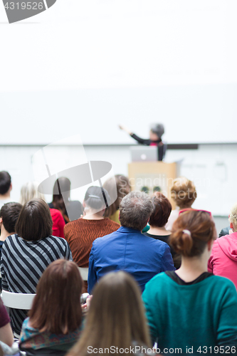 Image of Woman giving presentation on business conference.