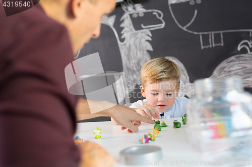 Image of Cute little toddler boy at child therapy session.