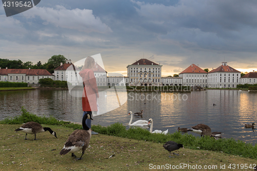 Image of Dramatic post storm sunset scenery of Nymphenburg palace in Munich Germany.