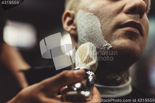 Image of Anonymous barber shaving client