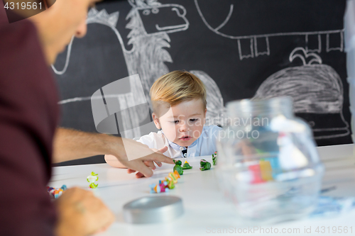 Image of Cute little toddler boy at child therapy session.