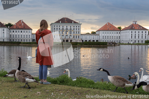 Image of Dramatic post storm sunset scenery of Nymphenburg palace in Munich Germany.