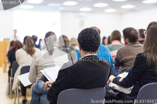 Image of Woman giving presentation on business conference.