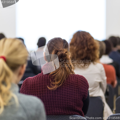 Image of Speaker at Business Conference and Presentation.