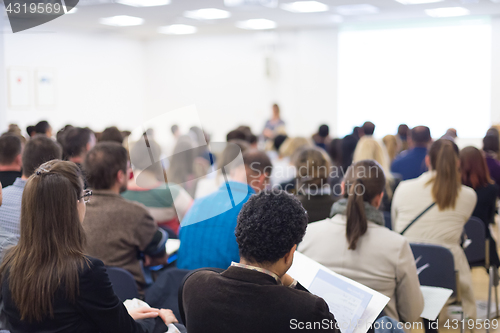 Image of Woman giving presentation on business conference.