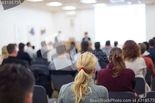 Image of Woman giving presentation on business conference.