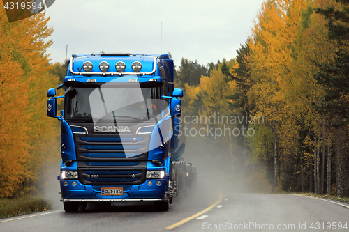 Image of Blue Scania R580 Tank Truck Transport on Wet Autumn Road