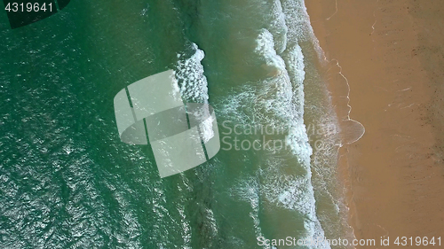 Image of Splashing water washing sand