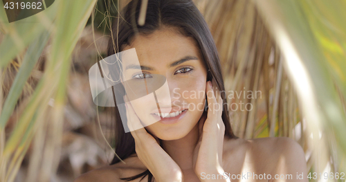 Image of Amazing ethnic woman posing at camera