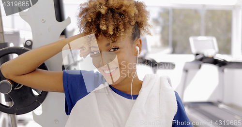 Image of Charming girl posing in gym