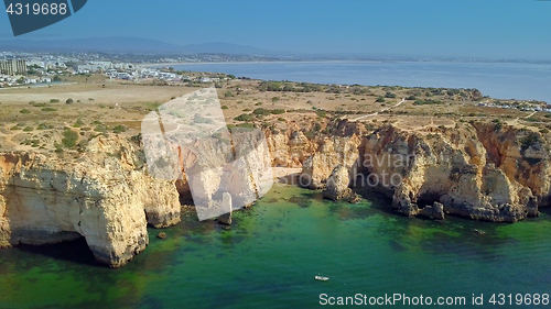 Image of Landscape of rocky coastline and city