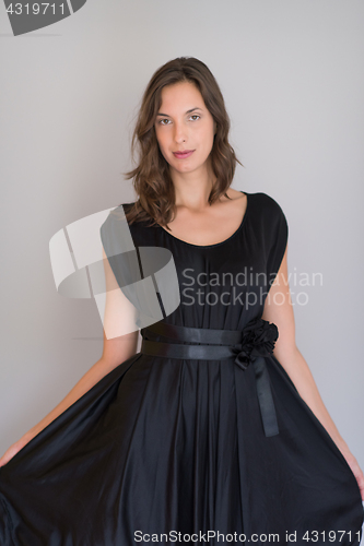 Image of woman in a black dress isolated on white background