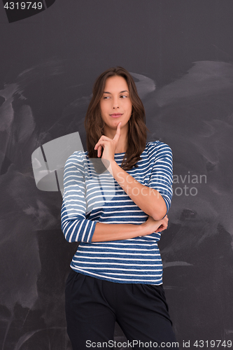 Image of woman standing in front of chalk drawing board