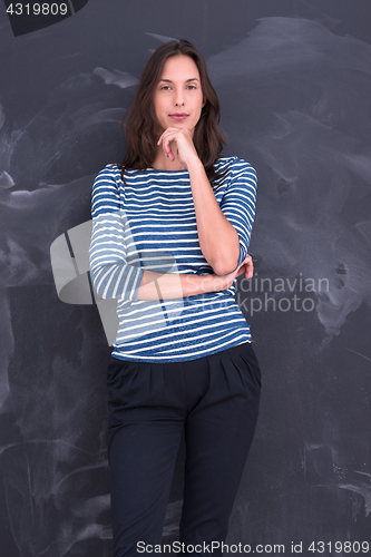 Image of woman standing in front of chalk drawing board