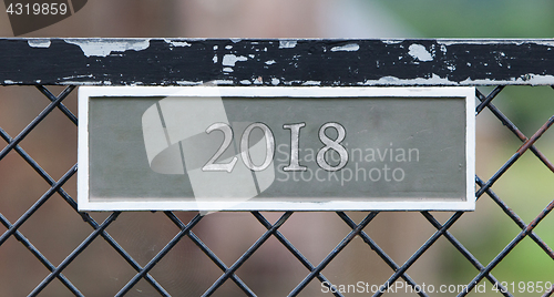 Image of Sign on fence - 2018