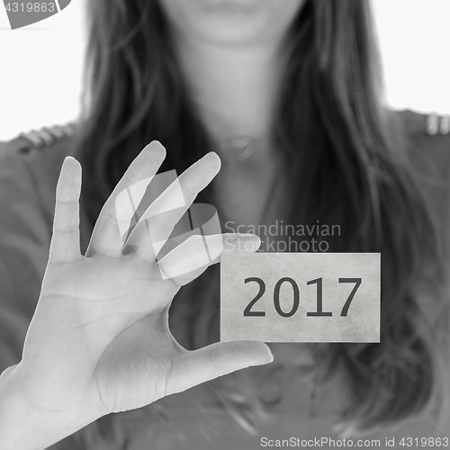 Image of Woman showing a business card - 2017