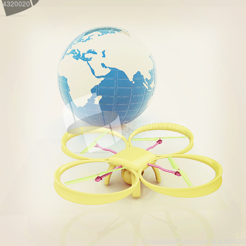 Image of Quadrocopter Drone with Earth Globe and remote controller on a w