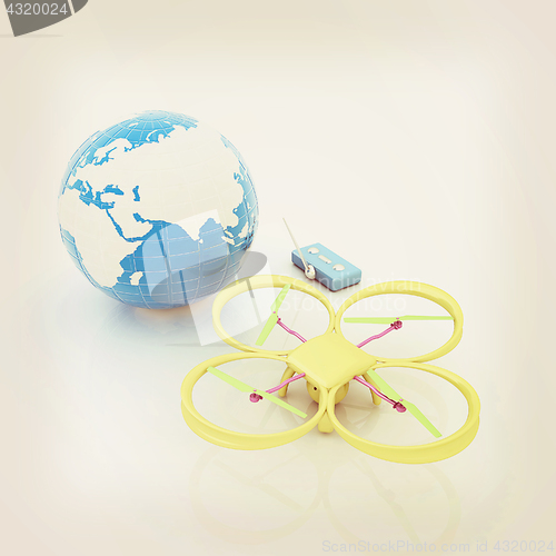 Image of Quadrocopter Drone with Earth Globe and remote controller on a w