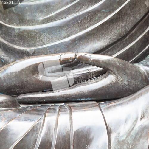 Image of Detail of Buddha statue with Dhyana hand position, the gesture o