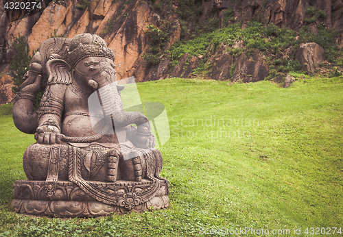 Image of Ganesha statue in a beautiful mountain garden