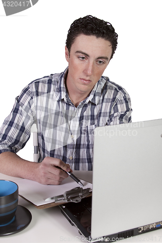 Image of Businessman at His Desk Working