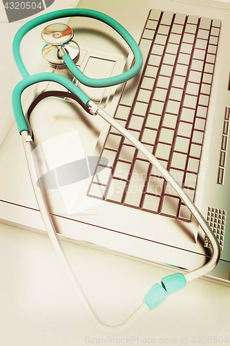 Image of silver laptop diagnosis with stethoscope. 3D illustration. Vinta