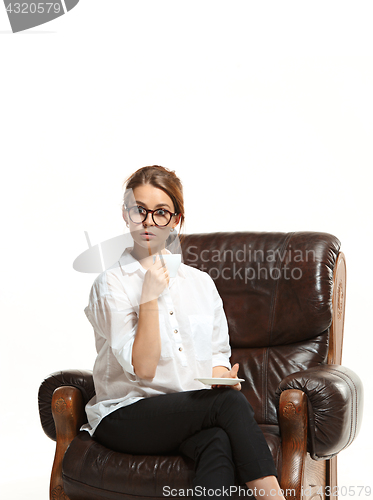 Image of attractive businesswoman have a coffee break