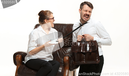 Image of The young man and beautiful woman in business suit at office on white background