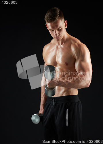 Image of man with dumbbells exercising