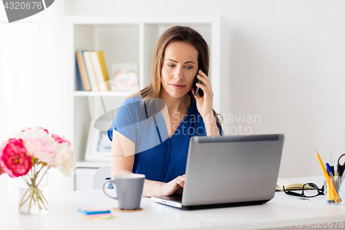 Image of woman calling on smartphone at office or home
